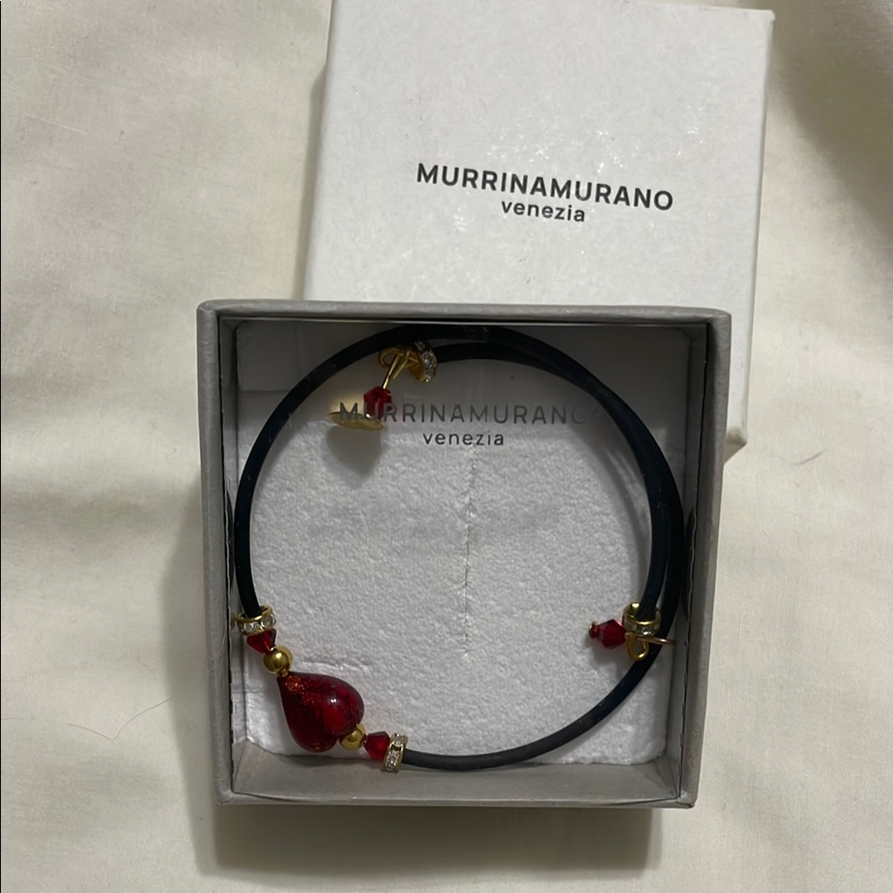 Elegant Black and Red Bracelet with Gold Accents